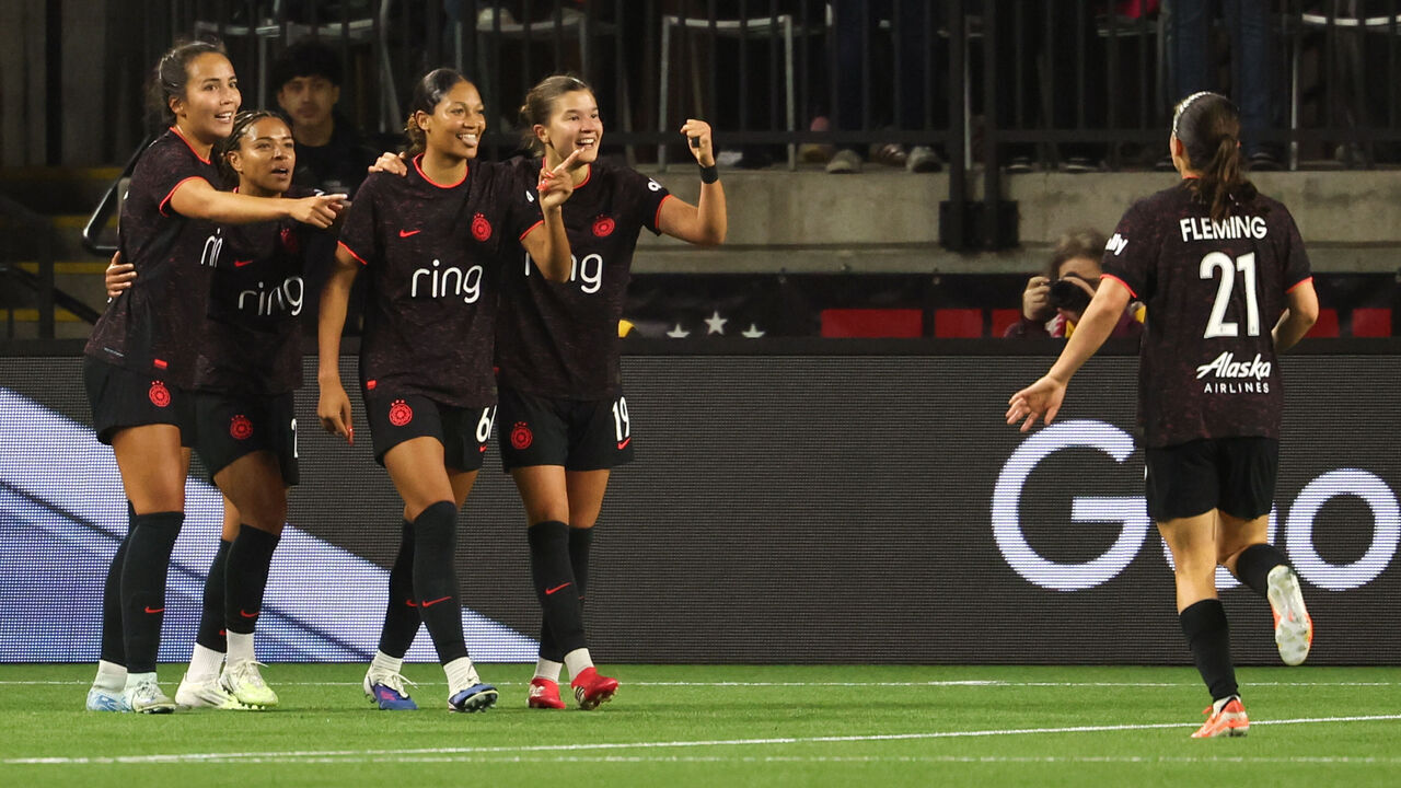 PORTLAND, OREGON - MARCH 20: Players of Portland Thorns FC celebrate a goal during an NWSL match between Portland Thorns FC and Seattle Reign at Providence Park on March 20, 2026 in Portland, Oregon.