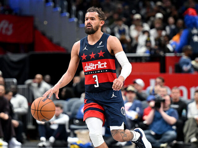 WASHINGTON, DC - MARCH 16: Trae Young #3 of the Washington Wizards handles the ball against the Golden State Warriors at Capital One Arena on March 16, 2026 in Washington, DC.