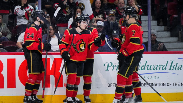 OTTAWA, CANADA - MARCH 21: Ridly Greig #71 of the Ottawa Senators celebrates his third-period goal against the Toronto Maple Leafs with teammates Dylan Cozens #24, Jordan Spence #10 and Brady Tkachuk #7 on March 21, 2026 at Canadian Tire Centre in Ottawa, Ontario, Canada.
