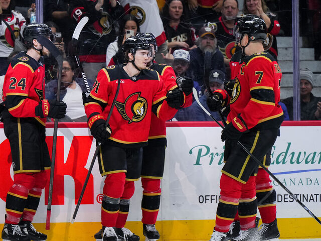 OTTAWA, CANADA - MARCH 21: Ridly Greig #71 of the Ottawa Senators celebrates his third-period goal against the Toronto Maple Leafs with teammates Dylan Cozens #24, Jordan Spence #10 and Brady Tkachuk #7 on March 21, 2026 at Canadian Tire Centre in Ottawa, Ontario, Canada.