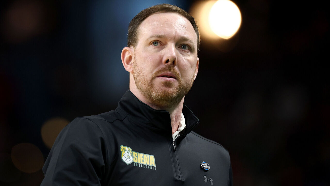 GREENVILLE, SOUTH CAROLINA - MARCH 19: Head coach Gerry McNamara of the Siena Saints looks on during the first half against the Duke Blue Devils in the first round of the 2026 NCAA Men's Basketball Tournament at Bon Secours Wellness Arena on March 19, 2026 in Greenville, South Carolina.