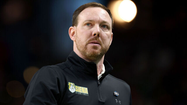 GREENVILLE, SOUTH CAROLINA - MARCH 19: Head coach Gerry McNamara of the Siena Saints looks on during the first half against the Duke Blue Devils in the first round of the 2026 NCAA Men's Basketball Tournament at Bon Secours Wellness Arena on March 19, 2026 in Greenville, South Carolina.