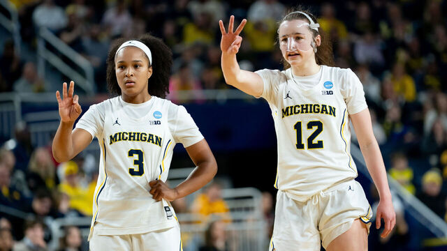 ANN ARBOR, MICHIGAN - MARCH 22: Mila Holloway #3 and Syla Swords #12 of the Michigan Wolverines display hand signals to their teammates during the first half against the NC State Wolfpack in the Second Round of the 2026 NCAA Women's Basketball Tournament at Crisler Arena on March 22, 2026 in Ann Arbor, Michigan.