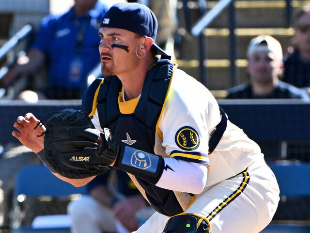 PHOENIX, ARIZONA - FEBRUARY 21, 2026: Reese McGuire #33 of the Milwaukee Brewers covers home plate during the fourth inning of a spring training game against the Cleveland Guardians at American Family Fields of Phoenix on February 21, 2026 in Phoenix, Arizona.