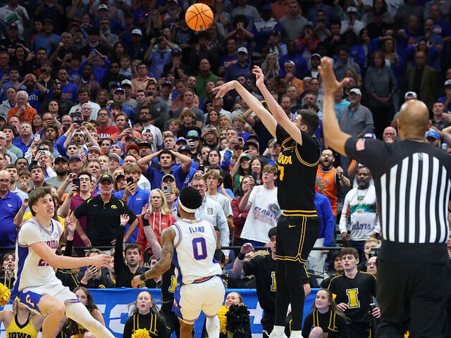 TAMPA, FLORIDA - MARCH 22: Alvaro Folgueiras #7 of the Iowa Hawkeyes attempts a three point basket against the Florida Gators with under five seconds left during the second half in the second round of the 2026 NCAA Men's Basketball Tournament at Benchmark International Arena on March 22, 2026 in Tampa, Florida.