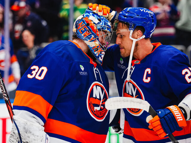 ELMONT, NEW YORK - MARCH 22: Anders Lee #27 and Ilya Sorokin #30 of the New York Islanders celebrate their 1-0 win against the Columbus Blue Jackets at UBS Arena on March 22, 2026 in Elmont, New York.