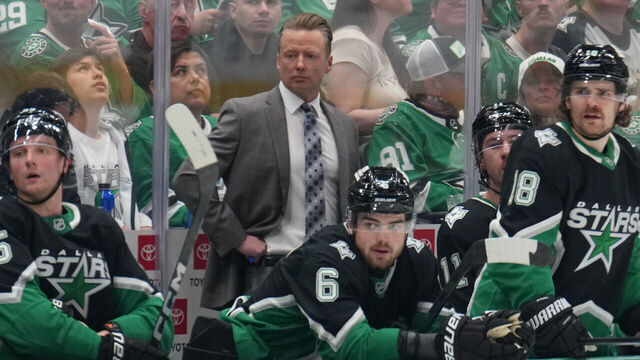 DALLAS, TX - MARCH 22: Glen Gulutzan watches the action from behind the bench against the Vegas Golden Knights at the American Airlines Center on March 22, 2026 in Dallas, Texas.