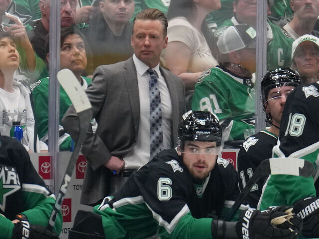 DALLAS, TX - MARCH 22: Glen Gulutzan watches the action from behind the bench against the Vegas Golden Knights at the American Airlines Center on March 22, 2026 in Dallas, Texas.