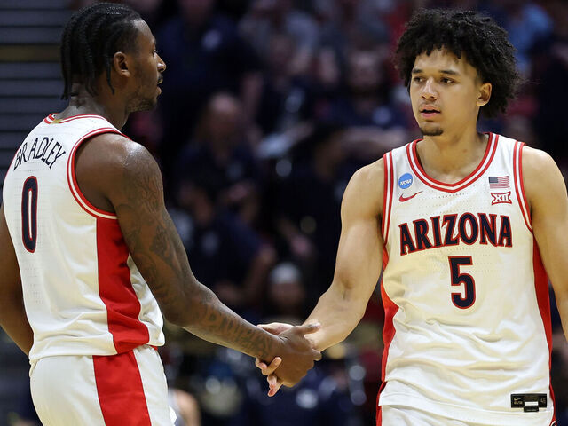 SAN DIEGO, CALIFORNIA - MARCH 22: Jaden Bradley #0 and Brayden Burries #5 of the Arizona Wildcats react during the second half against the Utah State Aggies in the second round of the 2026 NCAA Men's Basketball Tournament at Viejas Arena at San Diego State University on March 22, 2026 in San Diego, California.
