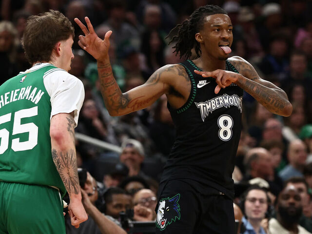 BOSTON, MA - MARCH 22: Bones Hyland #8 of the Minnesota Timberwolves celebrates after making a three-point basket as Baylor Scheierman #55 of the Boston Celtics runs by during the second half at TD Garden on March 22, 2026 in Boston, Massachusetts. NOTE TO USER: User expressly acknowledges and agrees that, by downloading and/or using this Photograph, user is consenting to the terms and conditions of the Getty Images License Agreement.