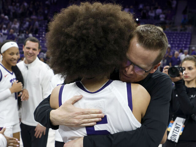FORT WORTH, TEXAS - MARCH 22: Head coach Mark Campbell of the TCU Horned Frogs celebrates with Olivia Miles #5 of the TCU Horned Frogs following the team's overtime victory over the Washington Huskies in the Second Round of the NCAA Women's Basketball Tournament on March 22, 2026 at Schollmaier Arena in Fort Worth, Texas.