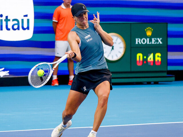 MIAMI GARDENS, FL - MARCH 19: Iga Swiatek (POL) in action during a Women's Singles Round 1 match against Magda Linette (POL) at the Miami Open on March 19, 2026, at Hard Rock Stadium in Miami Gardens, Florida,
