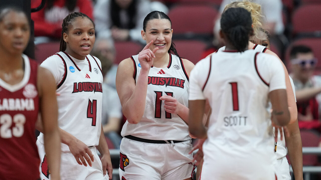 LOUISVILLE, KENTUCKY - MARCH 23: Elif Istanbulluoglu #11 of the Louisville Cardinals celebrates with teammates MacKenly Randolph #4 of the Louisville Cardinals and Reyna Scott #1 of the Louisville Cardinals against the Alabama Crimson Tide during the third quarter of a second round game of the 2026 NCAA Women's Basketball Tournament held at KFC YUM! Center on March 23, 2026 in Louisville, Kentucky.