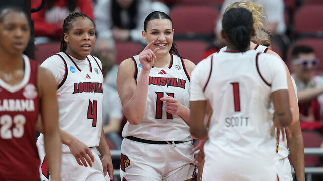 LOUISVILLE, KENTUCKY - MARCH 23: Elif Istanbulluoglu #11 of the Louisville Cardinals celebrates with teammates MacKenly Randolph #4 of the Louisville Cardinals and Reyna Scott #1 of the Louisville Cardinals against the Alabama Crimson Tide during the third quarter of a second round game of the 2026 NCAA Women's Basketball Tournament held at KFC YUM! Center on March 23, 2026 in Louisville, Kentucky.