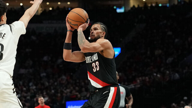 PORTLAND, OREGON - MARCH 23: Toumani Camara #33 of the Portland Trail Blazers shoots over Nolan Traore #88 of the Brooklyn Nets during the second half at Moda Center on March 23, 2026 in Portland, Oregon.