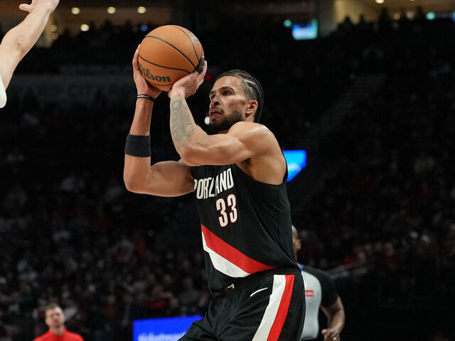 PORTLAND, OREGON - MARCH 23: Toumani Camara #33 of the Portland Trail Blazers shoots over Nolan Traore #88 of the Brooklyn Nets during the second half at Moda Center on March 23, 2026 in Portland, Oregon.