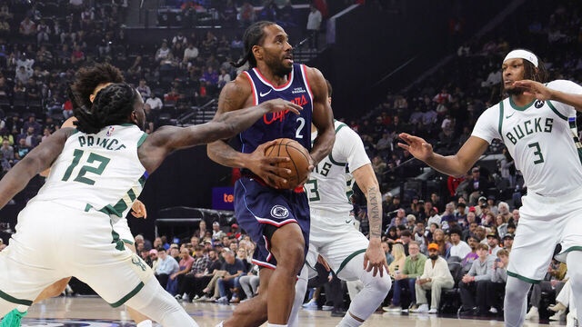 INGLEWOOD, CA - March 23: Kawhi Leonard #2 of the Los Angeles Clippers drives the lane against Myles Turner #3 and Taurean Prince #12 of the Milwaukee Bucks during the first half on March 23, 2026 at the Intuit Dome in Inglewood, California.