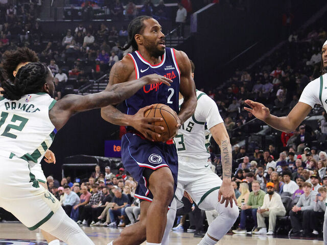 INGLEWOOD, CA - March 23: Kawhi Leonard #2 of the Los Angeles Clippers drives the lane against Myles Turner #3 and Taurean Prince #12 of the Milwaukee Bucks during the first half on March 23, 2026 at the Intuit Dome in Inglewood, California.