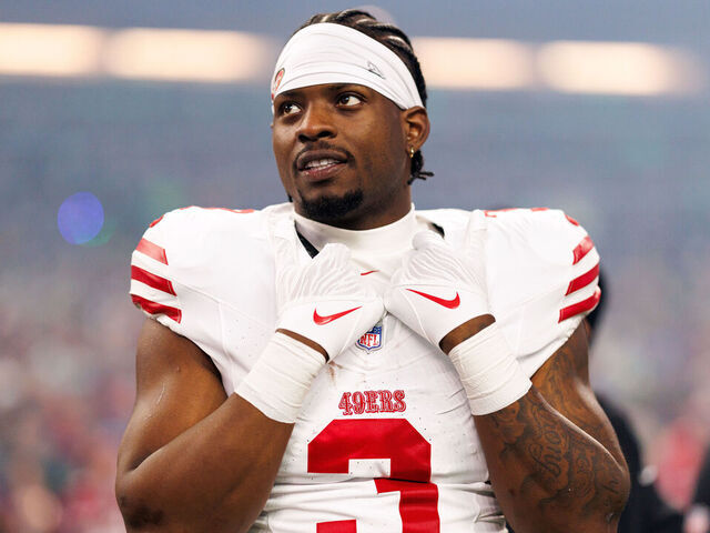 SEATTLE, WASHINGTON - JANUARY 17: Brian Robinson Jr. #3 of the San Francisco 49ers stands on the sidelines during the national anthem prior to an NFL divisional playoff football game against the Seattle Seahawks at Lumen Field on January 17, 2026 in Seattle, Washington.