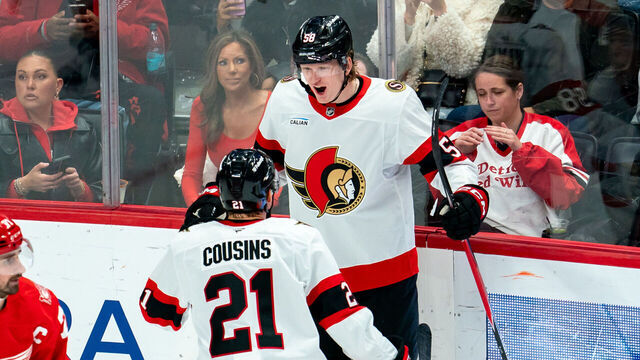DETROIT, MICHIGAN - MARCH 24: Carter Yakemchuk #58 of the Ottawa Senators celebrates his first NHL goal with Nick Cousins #21 during the second period against the Detroit Red Wings at Little Caesars Arena on March 24, 2026 in Detroit, Michigan.