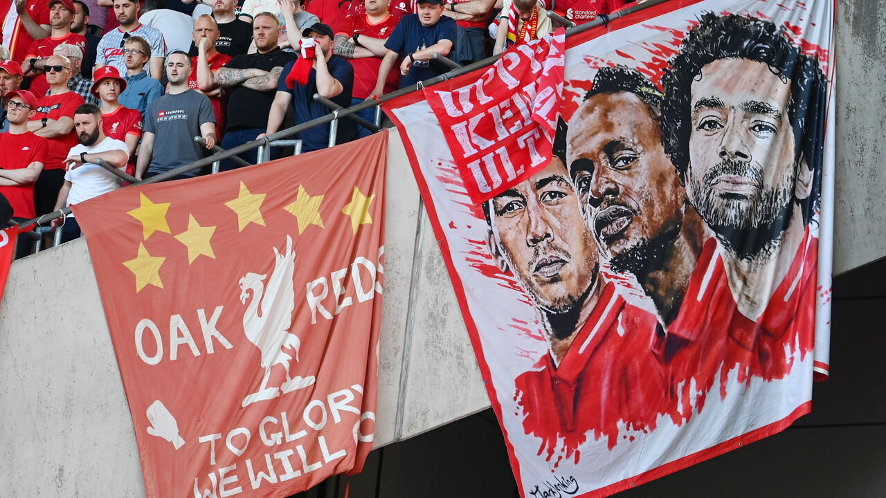 LONDON, ENGLAND - MAY 14: Liverpool fans display a banner with the faces of Roberto Firmino, Sadio Mane and Mohamed Salah of Liverpool during The FA Cup Final match between Chelsea and Liverpool at Wembley Stadium on May 14, 2022 in London, England.