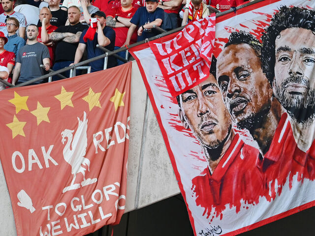 LONDON, ENGLAND - MAY 14: Liverpool fans display a banner with the faces of Roberto Firmino, Sadio Mane and Mohamed Salah of Liverpool during The FA Cup Final match between Chelsea and Liverpool at Wembley Stadium on May 14, 2022 in London, England.