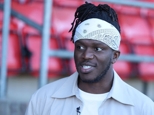 DAGENHAM, ENGLAND - MARCH 21: KSI, part owner of Dagenham & Redbridge, is pictured before the National League South match between Dagenham & Redbridge and Torquay United at Chigwell Construction Stadium on March 21, 2026 in Dagenham, England.