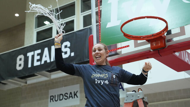 ITHACA, NY - MARCH 14: Princeton Tigers Head Coach Carla Berube finishes cutting down the net after winning the Ivy League Women's Basketball Championship game between the Harvard Crimson and the Princeton Tigers on March 14, 2026, at Newman Arena in Itaca, NY.