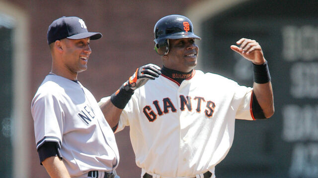 Yankees shortstop Derek Jeter (left) and Giants slugger Barry Bonds (right) share a laugh after Bonds stole second base during the San Francisco Giants 7-2 defeat of the New York Yankees at AT&T Park June 24, 2007 in San Francisco, California.