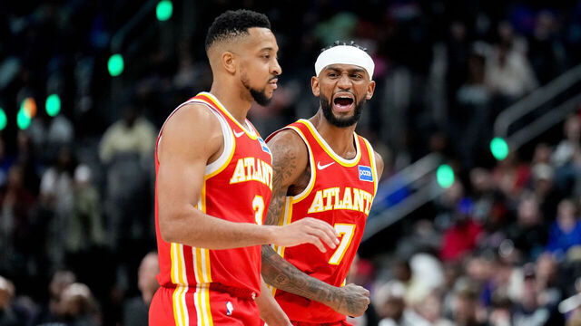 DETROIT, MICHIGAN - MARCH 25: Nickeil Alexander-Walker #7 and CJ McCollum #3 of the Atlanta Hawks celebrate during the fourth quarter at Little Caesars Arena on March 25, 2026 in Detroit, Michigan.