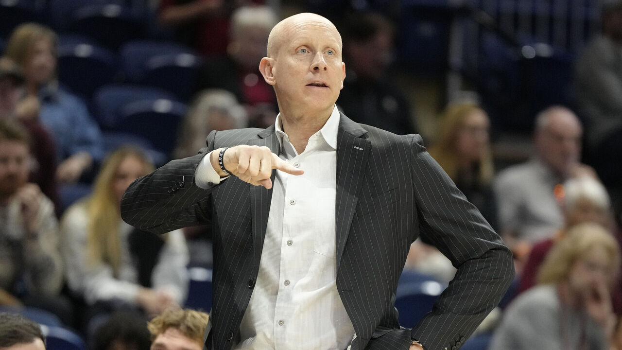 WASHINGTON, DC - MARCH 10: Head coach Chris Mack of the Charleston Cougars signals to his players during the Jersey Mike's CAA Men's Basketball Tournament against the North Carolina-Wilmington Seahawks at CareFirst Arena on March 10, 2025 in Washington, DC.