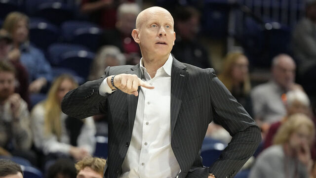 WASHINGTON, DC - MARCH 10: Head coach Chris Mack of the Charleston Cougars signals to his players during the Jersey Mike's CAA Men's Basketball Tournament against the North Carolina-Wilmington Seahawks at CareFirst Arena on March 10, 2025 in Washington, DC.