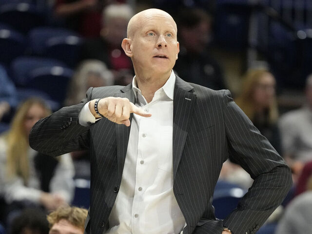 WASHINGTON, DC - MARCH 10: Head coach Chris Mack of the Charleston Cougars signals to his players during the Jersey Mike's CAA Men's Basketball Tournament against the North Carolina-Wilmington Seahawks at CareFirst Arena on March 10, 2025 in Washington, DC.