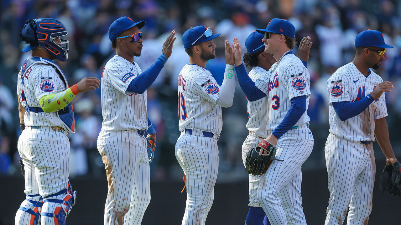 NEW YORK, NEW YORK - MARCH 26: Carson Benge #3 of the New York Mets high fives his teammates after the game against the Pittsburgh Pirates on Opening Day at Citi Field on March 26, 2026 in the Queens borough of New York City. The New York Mets won 11-7.