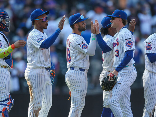 NEW YORK, NEW YORK - MARCH 26: Carson Benge #3 of the New York Mets high fives his teammates after the game against the Pittsburgh Pirates on Opening Day at Citi Field on March 26, 2026 in the Queens borough of New York City. The New York Mets won 11-7.