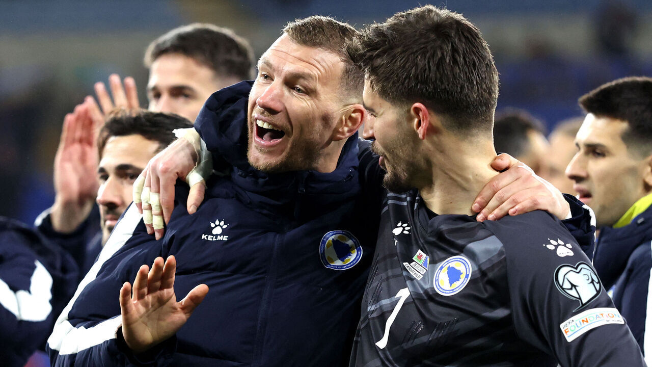 Bosnia-Herzegovina's forward Edin Dzeko (L) Bosnia-Herzegovina's goalkeeper Nikola Vasilj react after the FIFA World Cup qualification semi-final football match between Wales and Bosnia and Herzegovina, at Cardiff City Stadium, in Cardiff, on March 26, 2026.