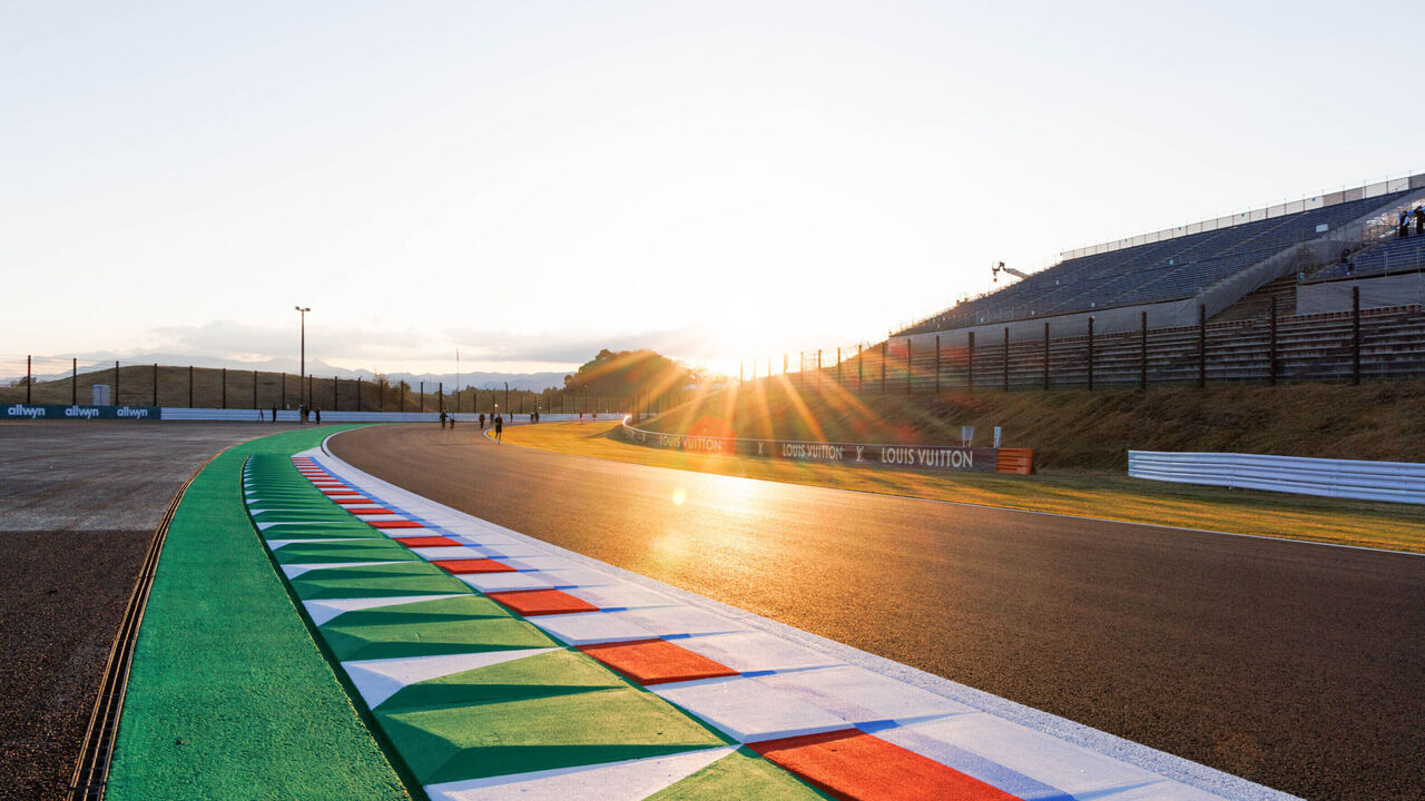 SUZUKA, MIE PREFECTURE, JAPAN - 2026/03/26: The sun sets on the ripple strip at the exit of the 130R corner ahead of the F1 Grand Prix of Japan at the Suzuka Circuit.