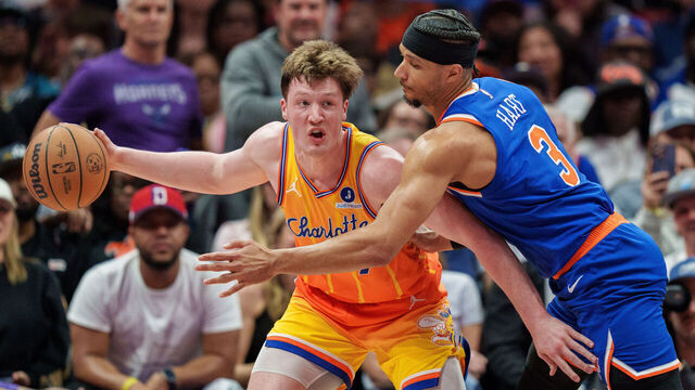 CHARLOTTE, NORTH CAROLINA - MARCH 26: Josh Hart #3 of the New York Knicks guards Kon Knueppel #7 of the Charlotte Hornets in the first half during their game at Spectrum Center on March 26, 2026 in Charlotte, North Carolina.