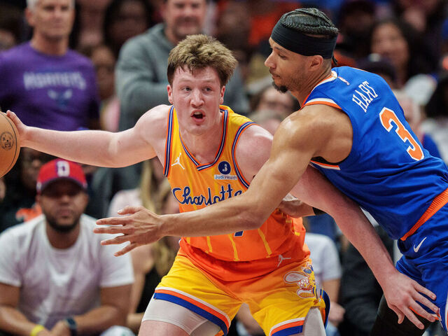 CHARLOTTE, NORTH CAROLINA - MARCH 26: Josh Hart #3 of the New York Knicks guards Kon Knueppel #7 of the Charlotte Hornets in the first half during their game at Spectrum Center on March 26, 2026 in Charlotte, North Carolina.