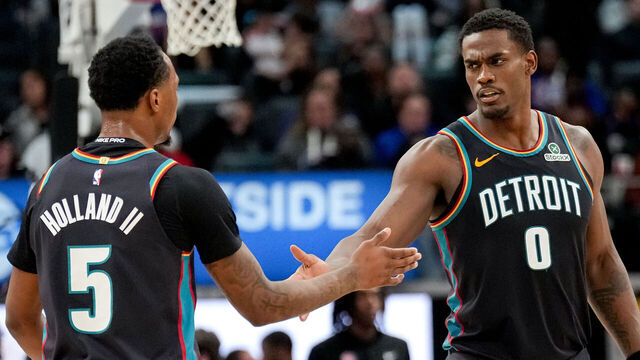 DETROIT, MICHIGAN - MARCH 26: Ronald Holland II #5 high fives Jalen Duren #0 of the Detroit Pistons during the second quarter against the New Orleans Pelicans at Little Caesars Arena on March 26, 2026 in Detroit, Michigan.