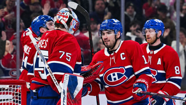 MONTREAL, QC - MARCH 26: Montreal Canadiens center Nick Suzuki (14) celebrates with goalie Jakub Dobes (75) the win after the Columbus Blue Jackets versus the Montreal Canadiens game on March 26, 2026, at Bell Centre in Montreal, QC
