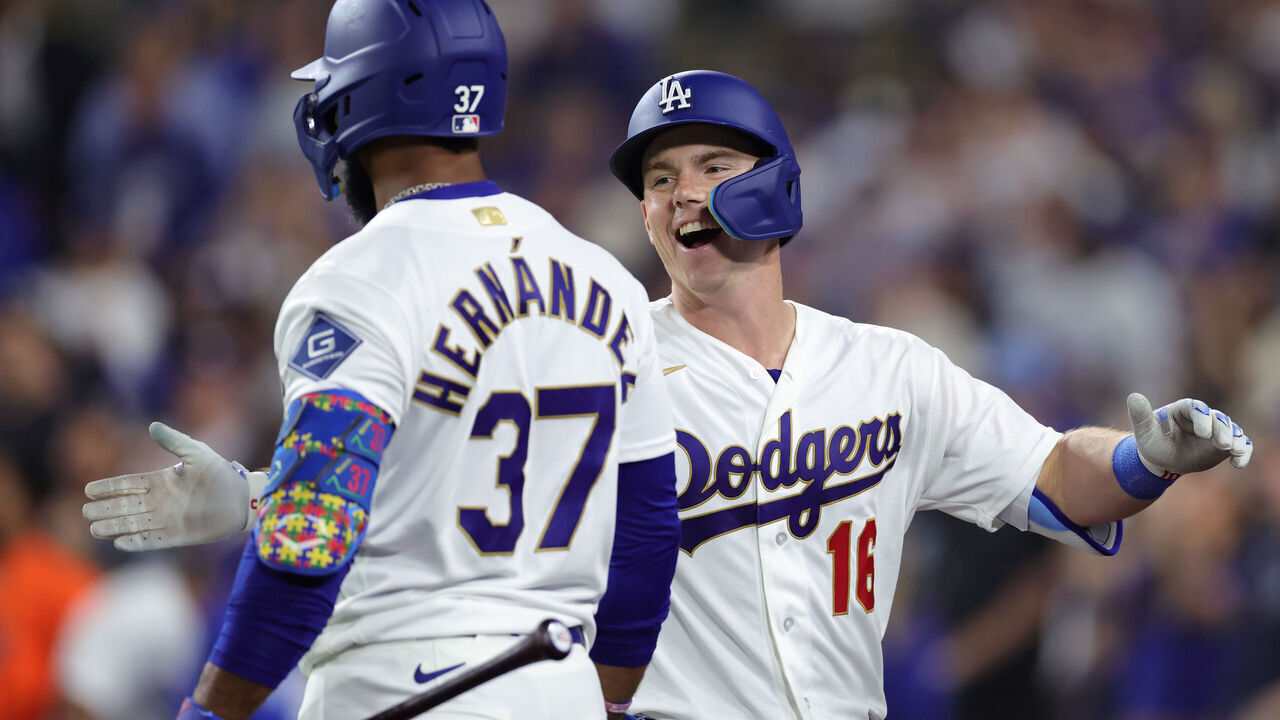 LOS ANGELES, CALIFORNIA - MARCH 26: Will Smith #16 of the Los Angeles Dodgers celebrates with Teoscar Hernández #37 after hitting a two-run home run against the Arizona Diamondbacks during the seventh inning during Opening Day at Dodger Stadium on March 26, 2026 in Los Angeles, California.