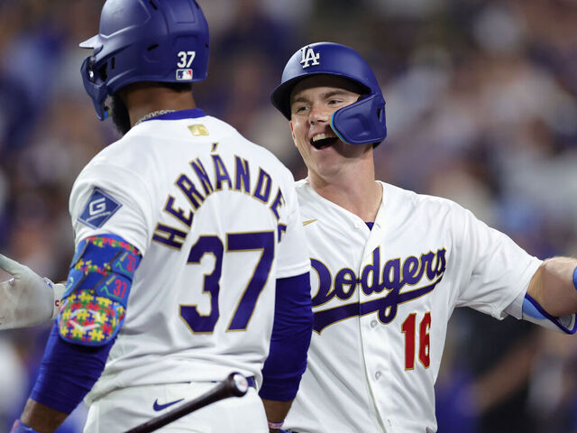 LOS ANGELES, CALIFORNIA - MARCH 26: Will Smith #16 of the Los Angeles Dodgers celebrates with Teoscar Hernández #37 after hitting a two-run home run against the Arizona Diamondbacks during the seventh inning during Opening Day at Dodger Stadium on March 26, 2026 in Los Angeles, California.