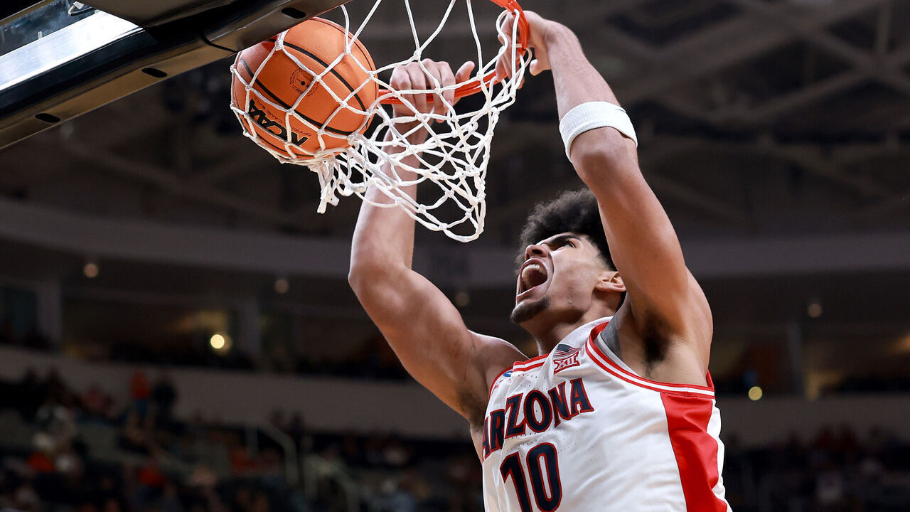 SAN JOSE, CALIFORNIA - MARCH 26: Koa Peat #10 of the Arizona Wildcats dunks the ball against the Arkansas Razorbacks during the second half in the Sweet Sixteen of the 2026 NCAA Men's Basketball Tournament at SAP Center on March 26, 2026 in San Jose, California.