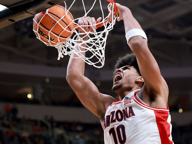 SAN JOSE, CALIFORNIA - MARCH 26: Koa Peat #10 of the Arizona Wildcats dunks the ball against the Arkansas Razorbacks during the second half in the Sweet Sixteen of the 2026 NCAA Men's Basketball Tournament at SAP Center on March 26, 2026 in San Jose, California.