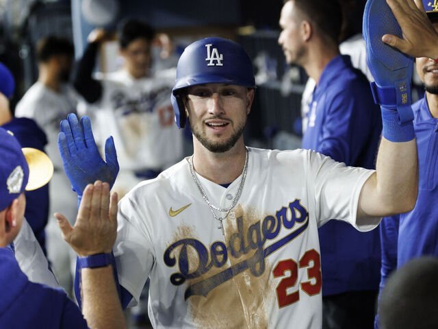 LOS ANGELES, CA - MARCH 26, 2026: Los Angeles Dodgers right fielder Kyle Tucker (23) gets high-fives in the dugout after scoring on an RBI single against the Arizona Diamondbacks in the seventh inning at Dodger Stadium on March 26, 2026 in Los Angeles, CA.(Gina Ferazzi / Los Angeles Times via Getty Images)