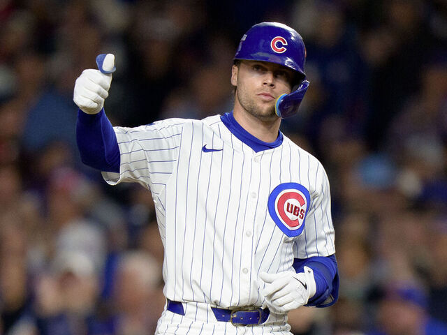 CHICAGO, ILLINOIS - OCTOBER 9: Nico Hoerner #2 of the Chicago Cubs celebrates a hit in Game Four of the National League Division Series against the Milwaukee Brewers at Wrigley Field on October 9, 2025 in Chicago, Illinois.