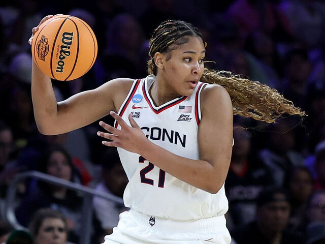 FORT WORTH, TEXAS - MARCH 27: Sarah Strong #21 of the UConn Huskies passes the ball against the North Carolina Tar Heels during the second quarter in the Sweet Sixteen of the 2026 NCAA Women's Basketball Tournament at Dickies Arena on March 27, 2026 in Fort Worth, Texas.