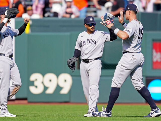 SAN FRANCISCO, CA - MARCH 27: Aaron Judge #99, Trent Grisham #12 and Cody Bellinger #35 of the New York Yankees celebrate after the Yankees defeated the San Francisco Giants in the game at Oracle Park on Friday, March 27, 2026 in San Francisco, California.
