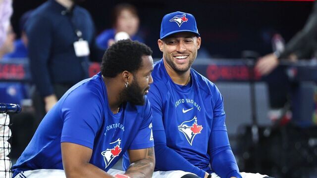 TORONTO, ON - March 26 George Springer and Vladimir Guerrero Jr. share a laugh during batting practice.The Toronto Blue Jays held their media day at the Rogers Centre in MLB baseball action ahead of their home opener on Friday.March 26 2026 Richard Lautens/Toronto Star (Richard Lautens/Toronto Star via Getty Images)